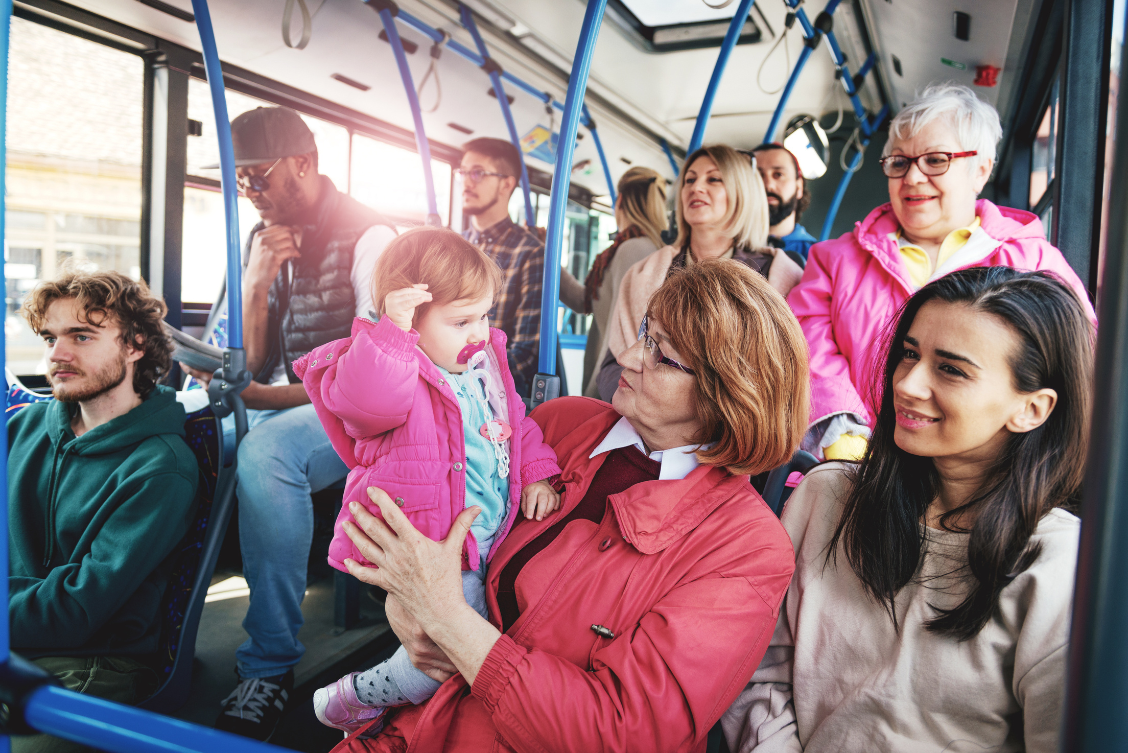 People of all ages in public bus